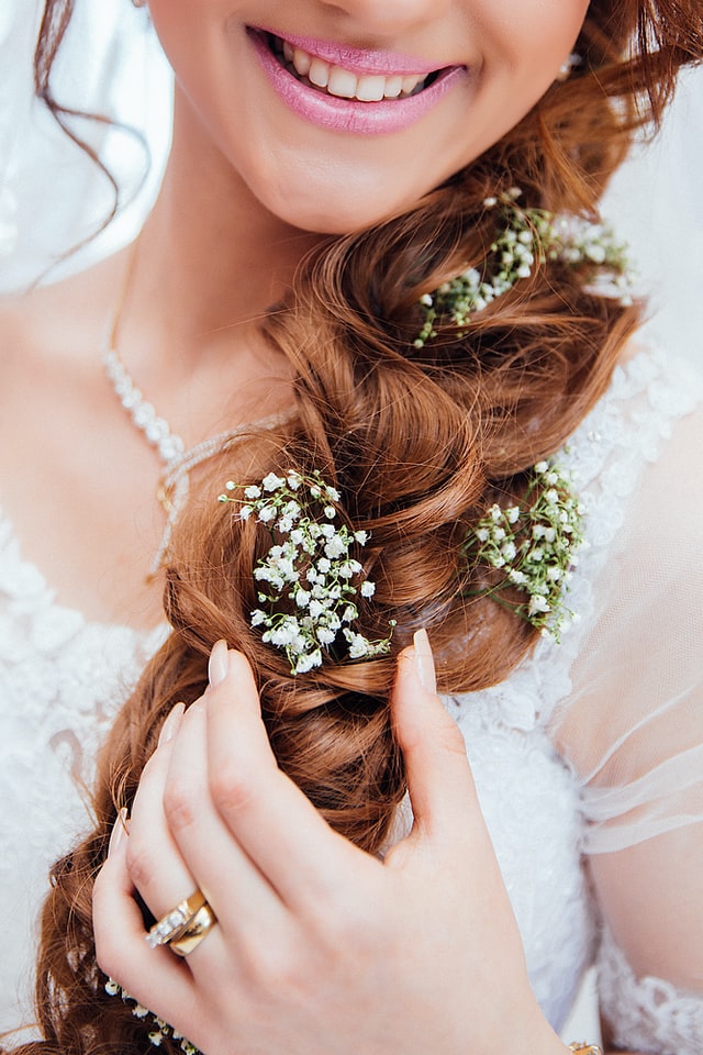 flowers arranged on bride's hair