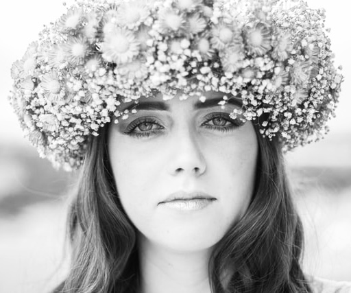 blue eyes woman with orange flower crown black and white