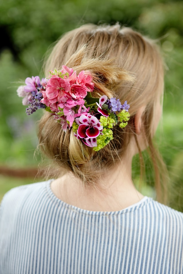 Beautiful flowers on woman's hair