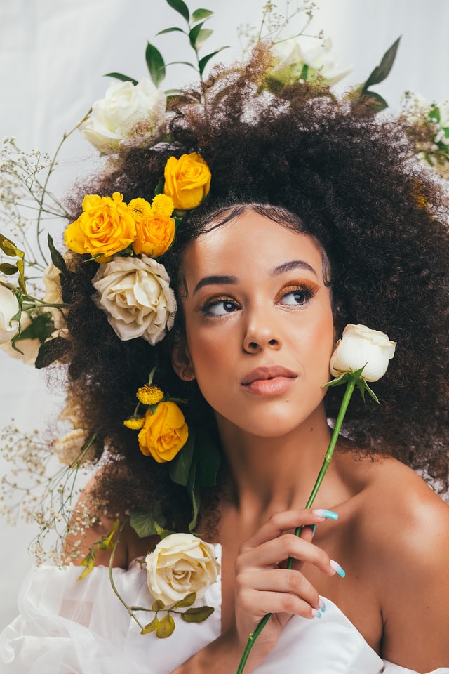 black woman with gorgeous flowers