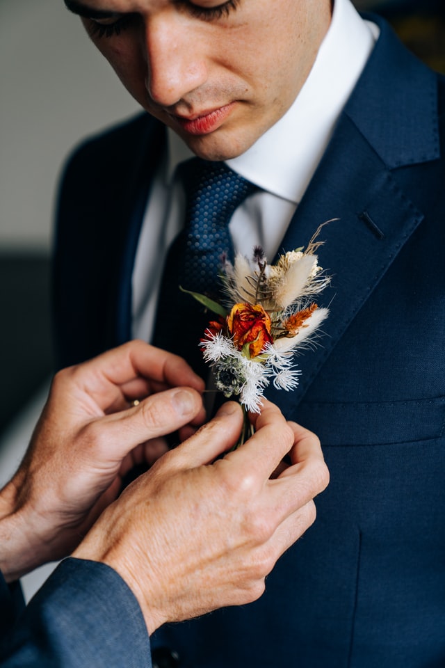 a flower broach with bridegroom