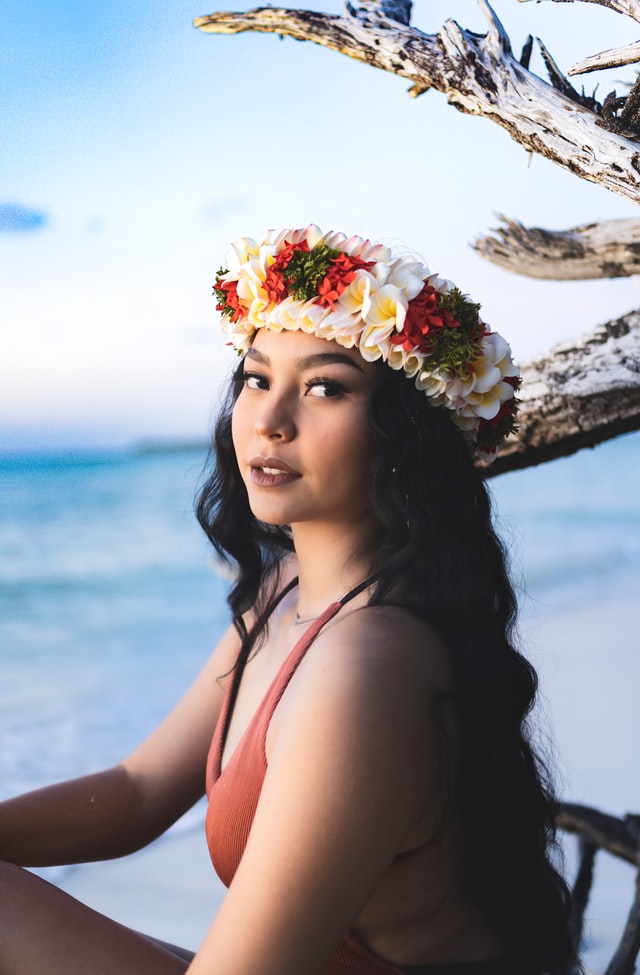 polynesian woman wearing flower lei